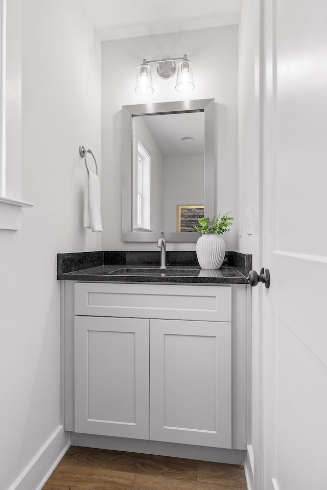 bathroom featuring vanity and wood-type flooring