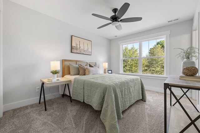 bedroom with light carpet and ceiling fan