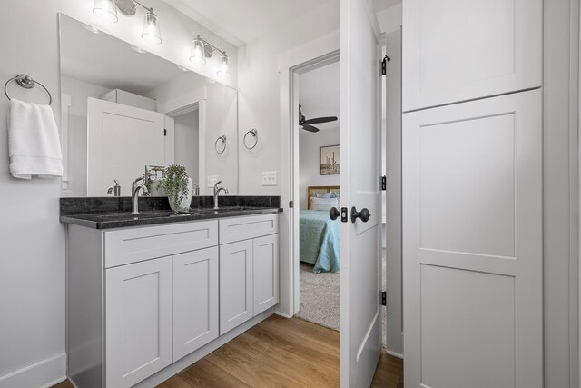 bathroom with vanity, wood-type flooring, and ceiling fan