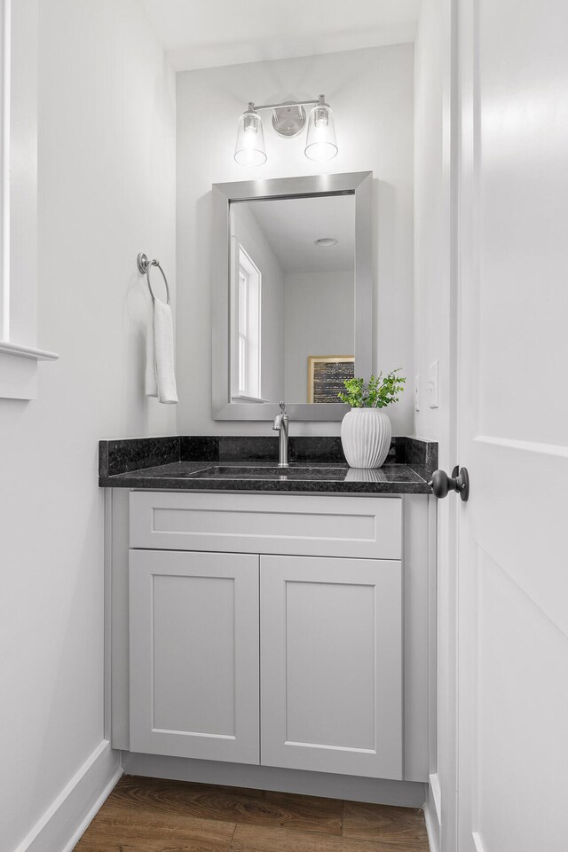 bathroom featuring vanity and hardwood / wood-style flooring