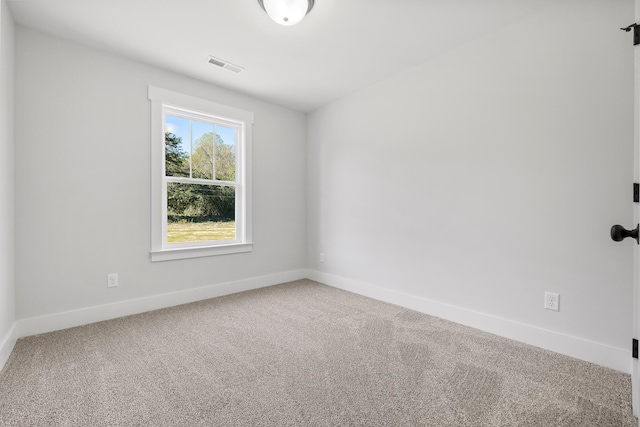 spare room featuring carpet flooring