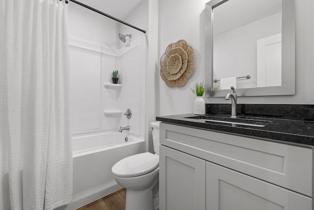 full bathroom with vanity, hardwood / wood-style floors, shower / tub combo with curtain, and toilet