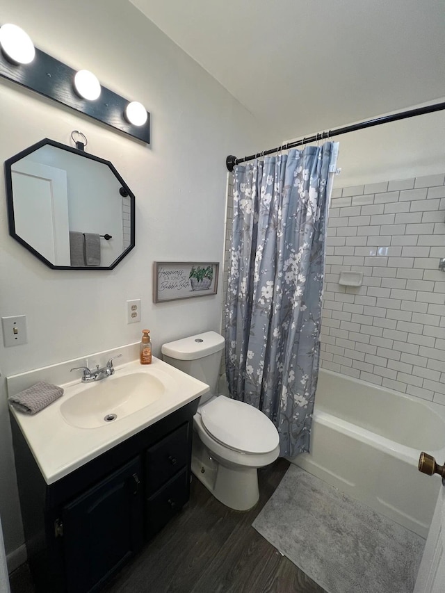 full bathroom with shower / bath combination with curtain, vanity, hardwood / wood-style floors, and toilet