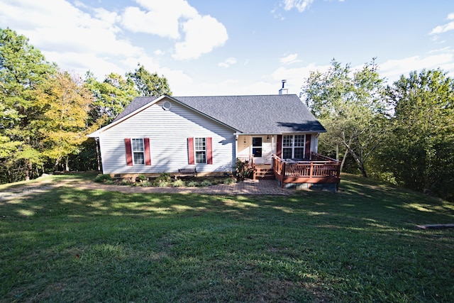 view of front of house featuring a front yard and a deck