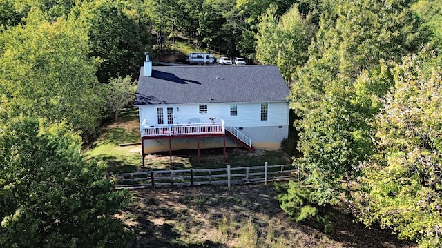 rear view of house featuring a deck