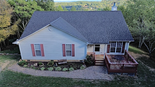 rear view of property with a wooden deck