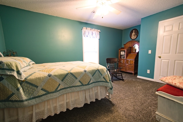 bedroom with dark colored carpet, ceiling fan, and a textured ceiling