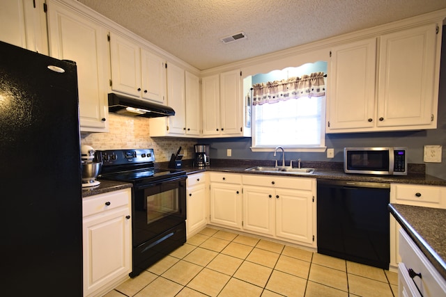 kitchen featuring black appliances, white cabinets, sink, light tile patterned floors, and a textured ceiling