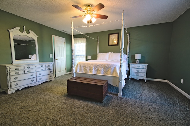 bedroom featuring dark colored carpet, ceiling fan, and a textured ceiling