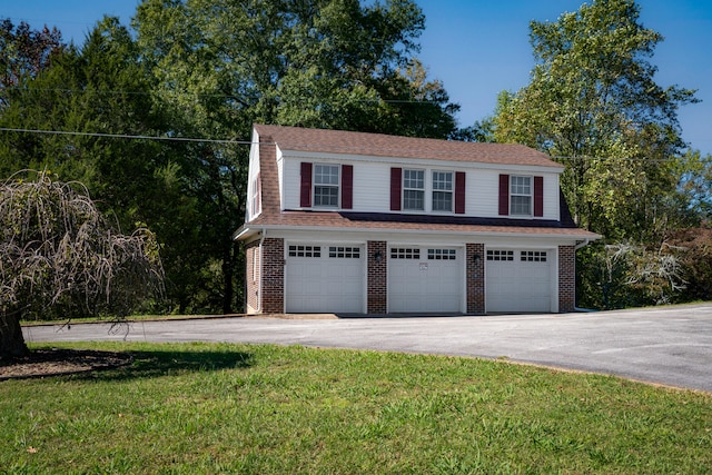 garage featuring a yard