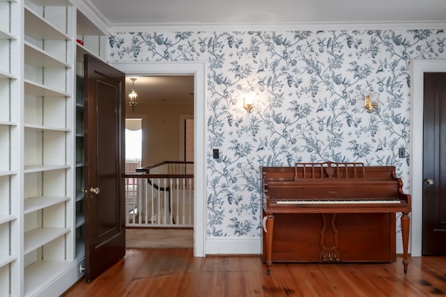 misc room with crown molding and hardwood / wood-style floors