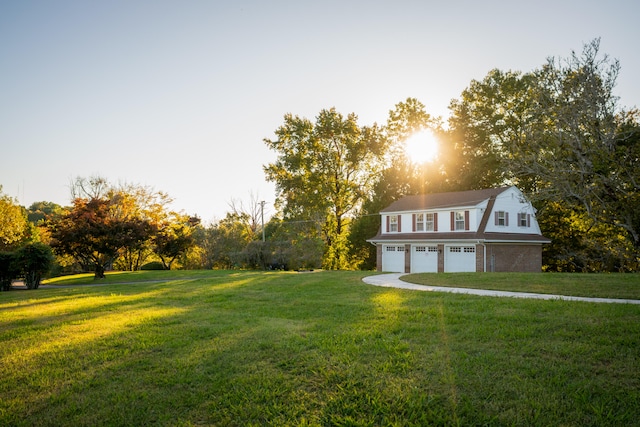 view of front of home with a garage and a front yard