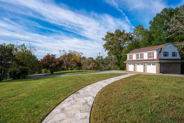 exterior space with a garage and a front lawn