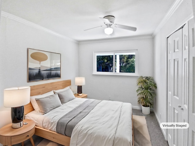 carpeted bedroom with ceiling fan, baseboards, and crown molding