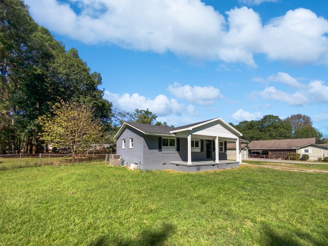 view of front of property featuring a front lawn and central AC unit