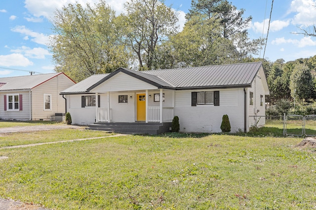 ranch-style home featuring a front yard