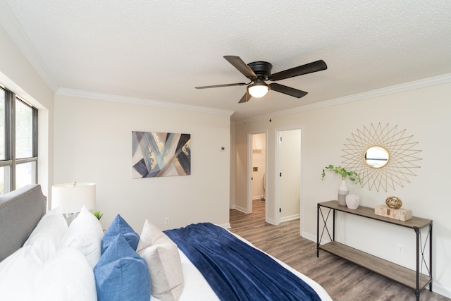 bedroom with crown molding, hardwood / wood-style floors, a textured ceiling, and ceiling fan