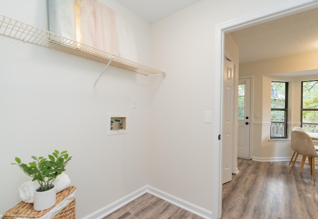 laundry area with dark wood-type flooring and washer hookup