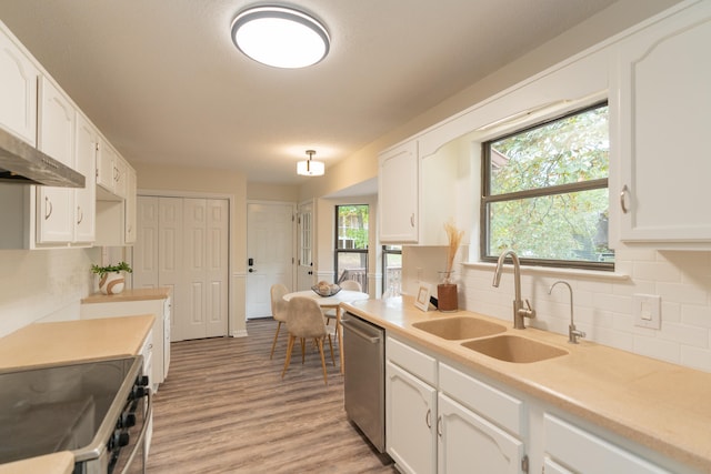 kitchen featuring white cabinets, sink, and stainless steel appliances