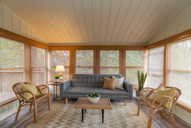 sunroom / solarium featuring lofted ceiling and wood ceiling