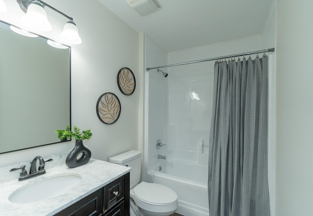 full bathroom with vanity, toilet, and shower / bath combo with shower curtain