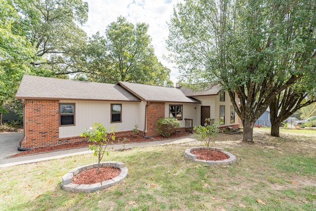 ranch-style house with a front yard