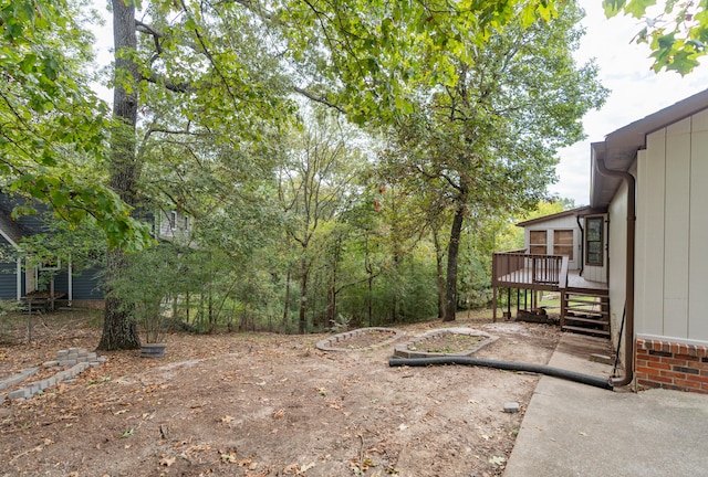 view of yard featuring a wooden deck