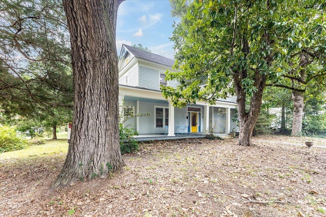 obstructed view of property with covered porch