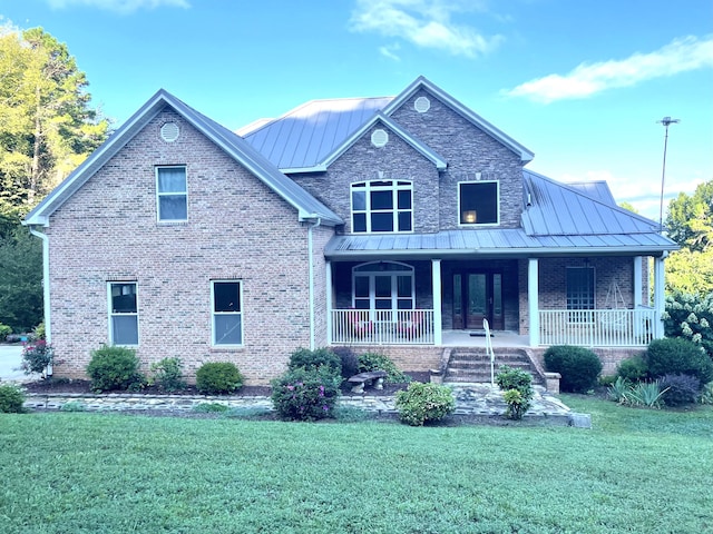 view of front of home featuring a porch and a front lawn