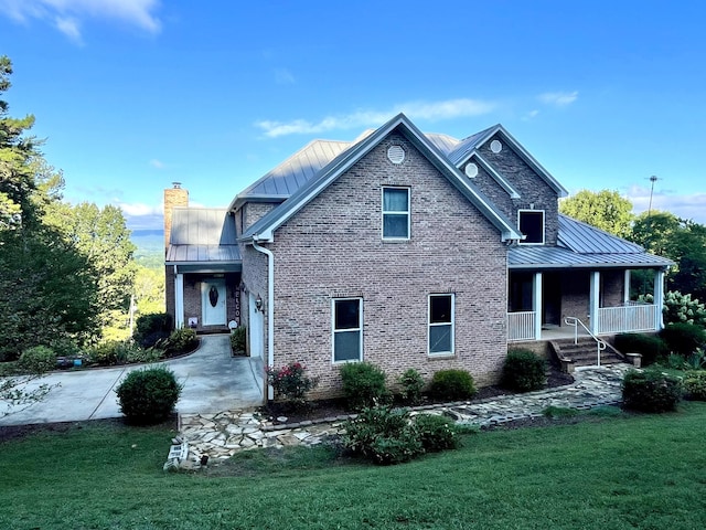 view of front of home featuring covered porch and a front yard