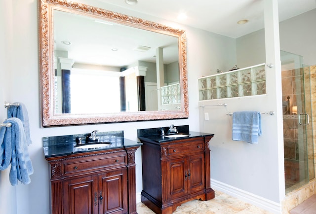 bathroom with vanity and a shower with shower door