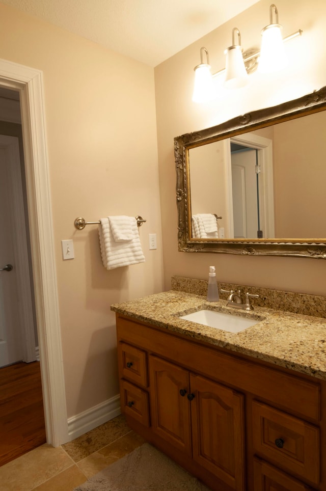 bathroom with vanity and tile patterned flooring