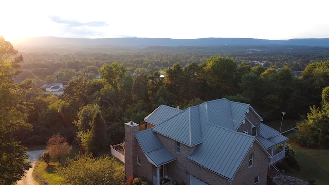 birds eye view of property with a mountain view