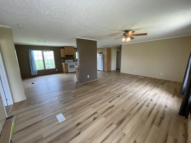 unfurnished living room featuring a textured ceiling, crown molding, ceiling fan with notable chandelier, and light hardwood / wood-style floors