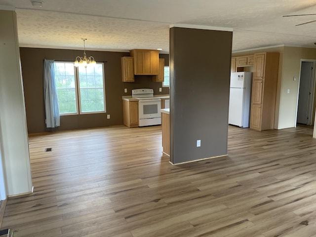 kitchen featuring hanging light fixtures, a textured ceiling, a chandelier, light hardwood / wood-style floors, and white appliances