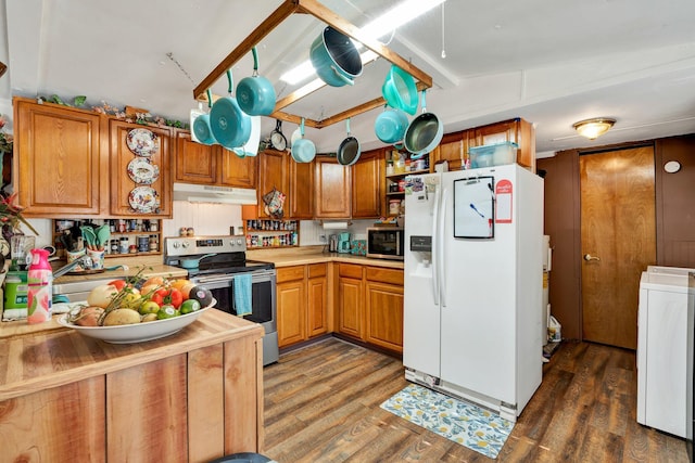 kitchen featuring wood counters, stainless steel appliances, dark hardwood / wood-style floors, and washer / clothes dryer