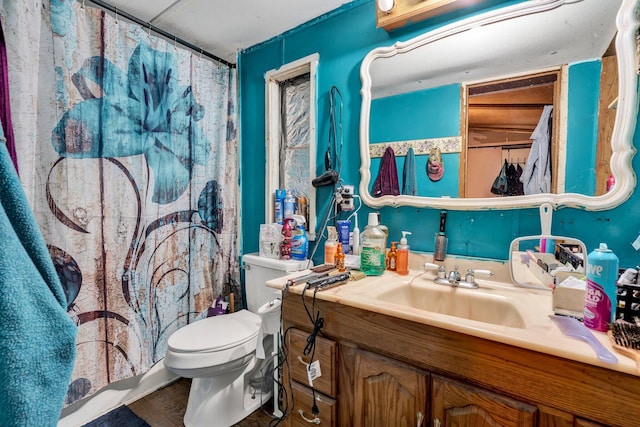 bathroom with toilet and vanity