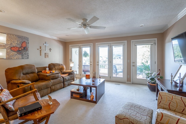 carpeted living room featuring crown molding, a textured ceiling, and ceiling fan