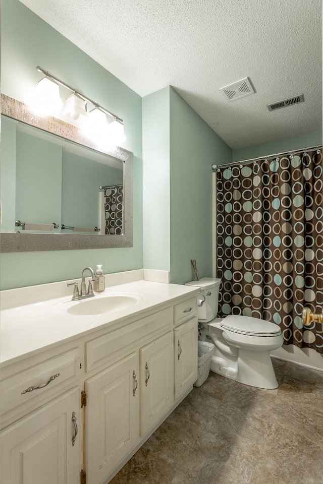 bathroom with toilet, a textured ceiling, curtained shower, and vanity