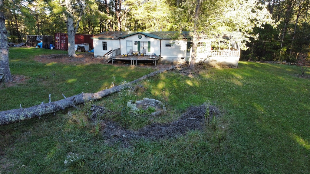 view of yard with a wooden deck