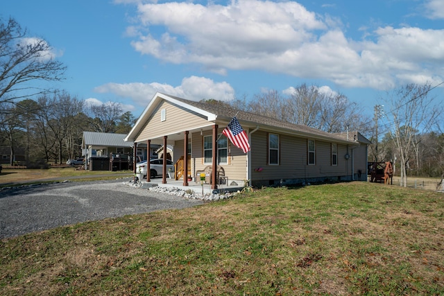 view of front facade with a front lawn and a porch