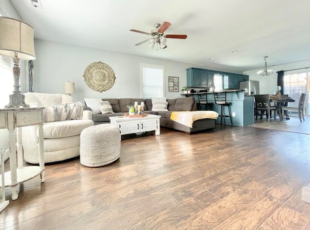 living room featuring hardwood / wood-style floors and ceiling fan