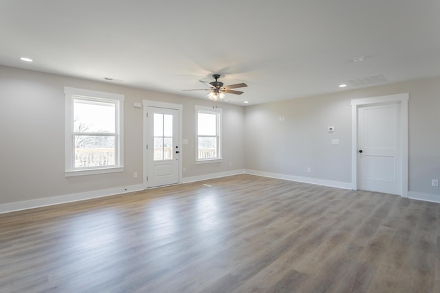 spare room with recessed lighting, a ceiling fan, baseboards, visible vents, and light wood-style floors