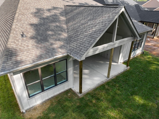 view of home's exterior with a patio and a lawn