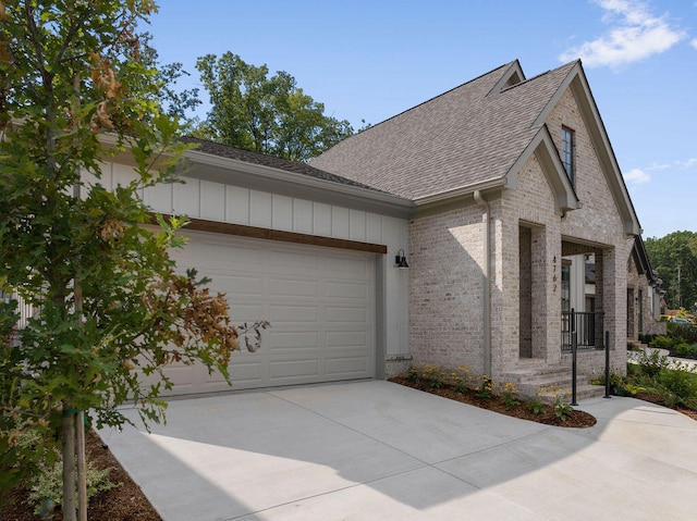 view of side of property with a garage