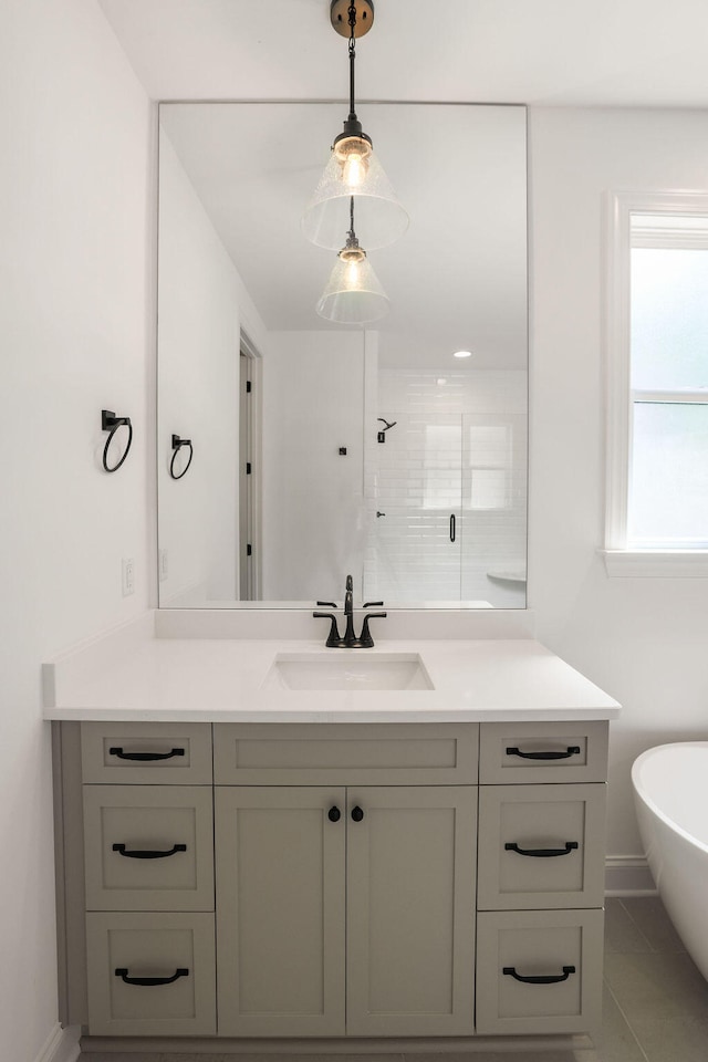 bathroom with tile patterned floors, vanity, and independent shower and bath