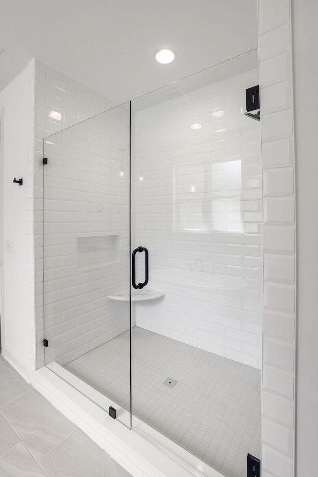 bathroom featuring tile patterned floors and walk in shower