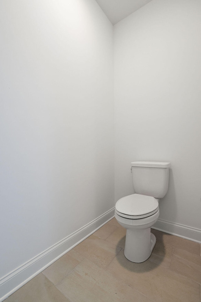 bathroom featuring tile patterned flooring and toilet