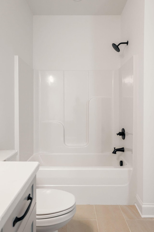 full bathroom featuring tile patterned floors, vanity,  shower combination, and toilet