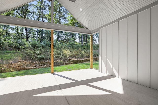 unfurnished sunroom with lofted ceiling